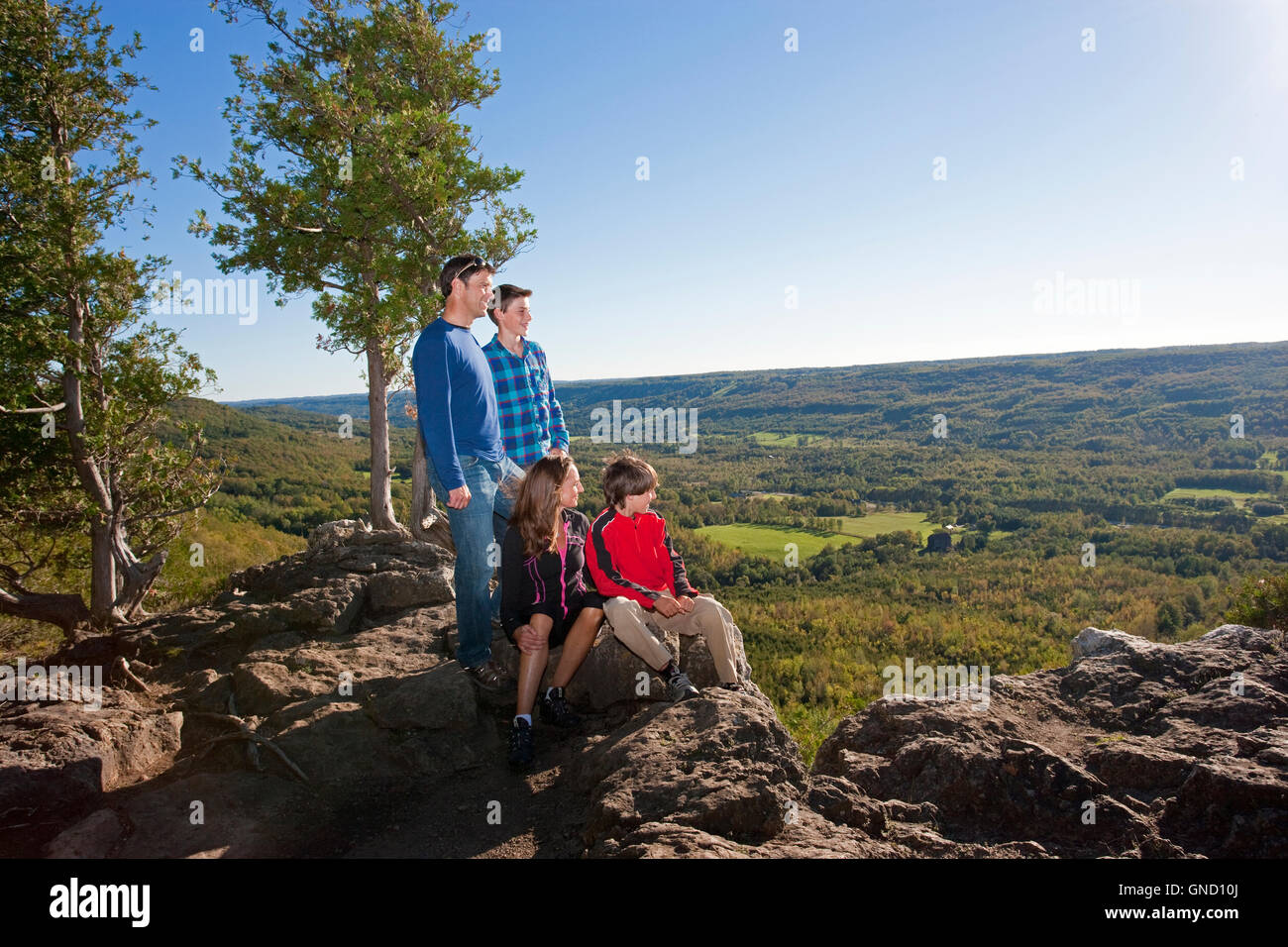 family hiking overlooking valley Canada, Ontario, Beaver Valley Stock Photo