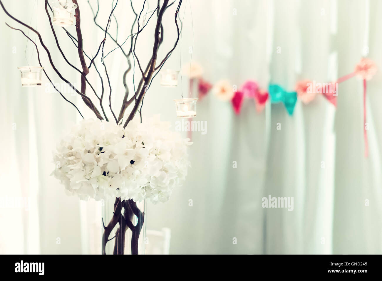 Vintage style ceremony decorations with a bouquet of white orchids and dry twigs Stock Photo