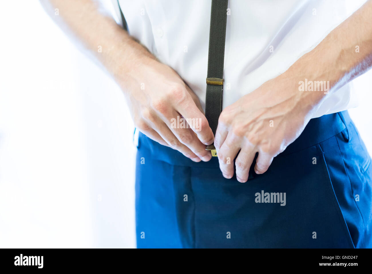 A Man in Gray Shirt Wearing Black Sunglasses Standing on the Street while  His Hands is in the Pocket of His Pants · Free Stock Photo