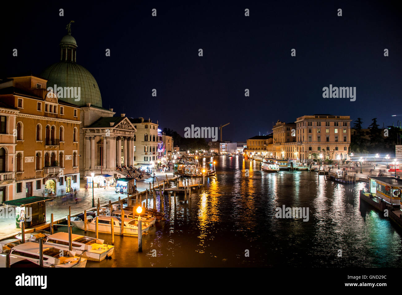 The big canal gondola and boats in romantic Venice in Italy by night ...