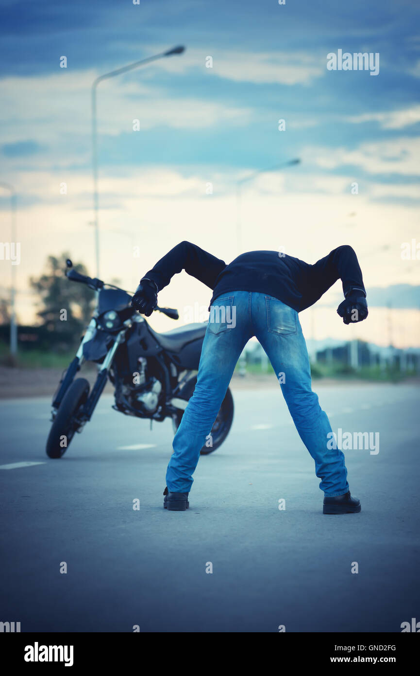 Man standing behind motorcycle hi-res stock photography and images - Alamy