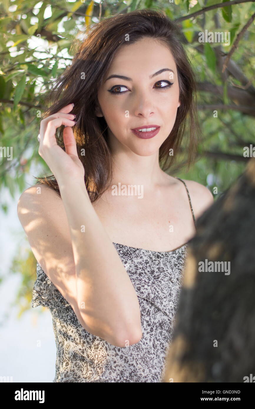 Portrait of a fashionable young woman outdoors Stock Photo