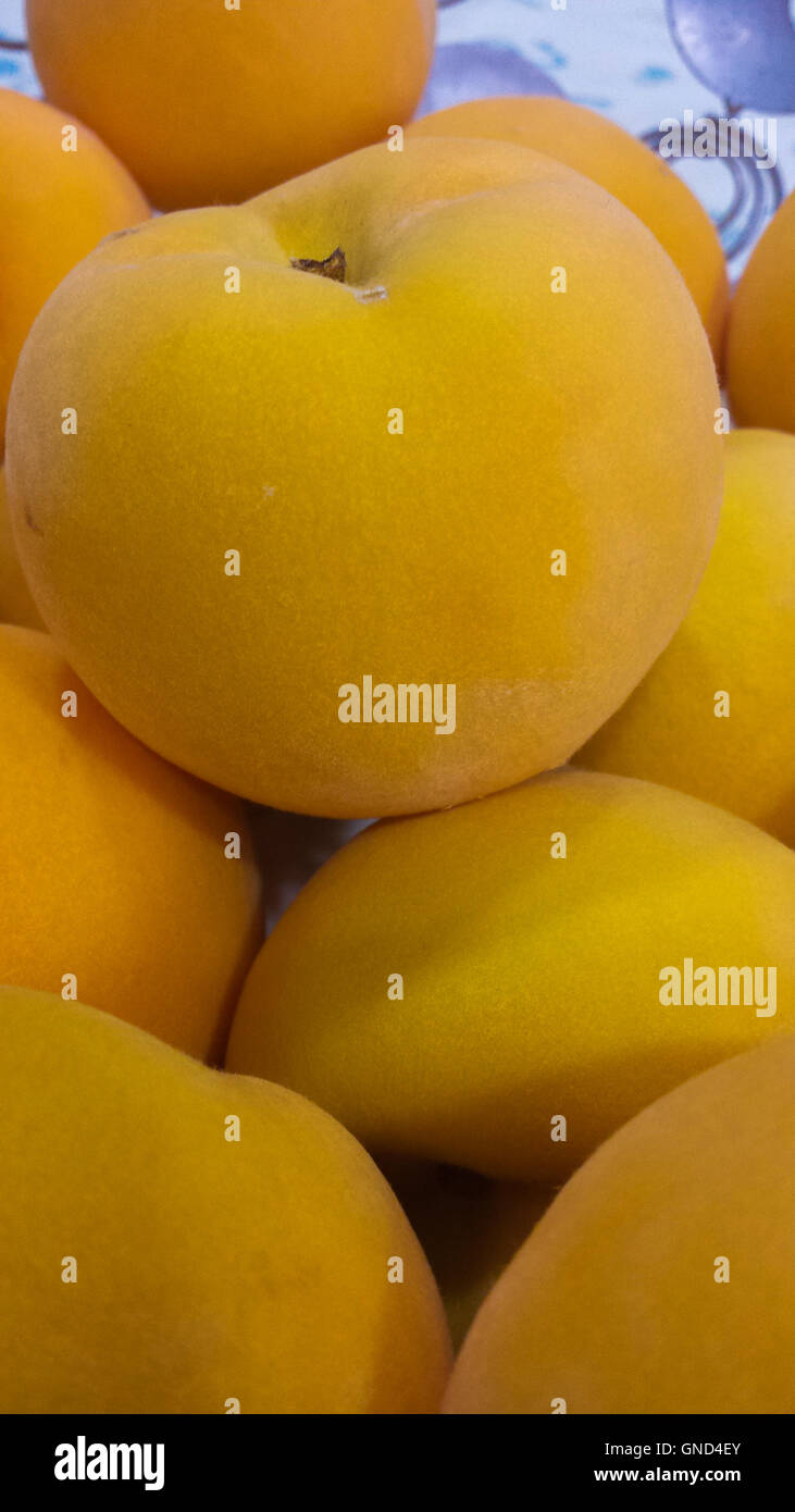 background with yellow peaches Stock Photo