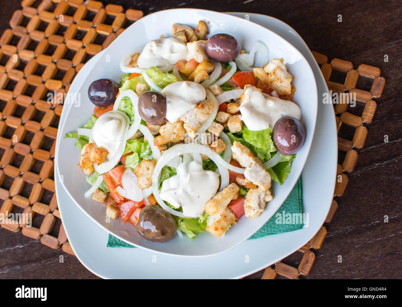 Caesar salad in a bowl served in a restaruant Stock Photo