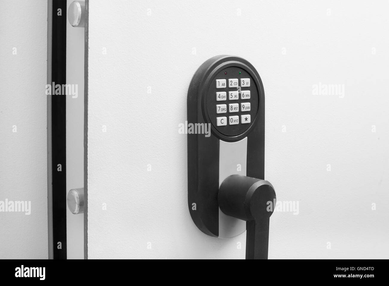 Interracial businessman hand entering security system code Stock Photo