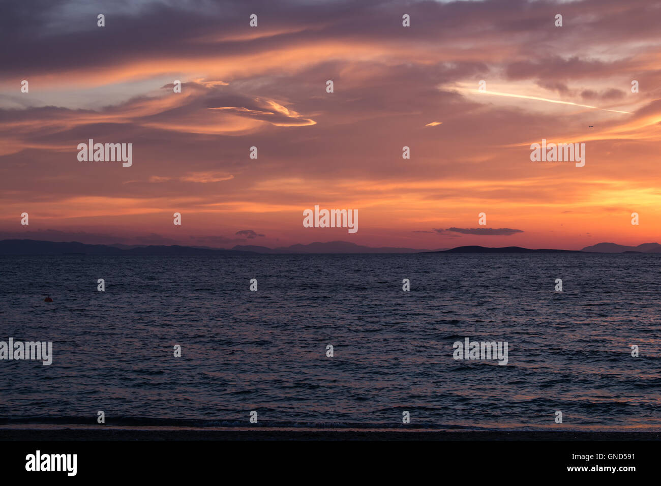 Calm Water Of The Aegean Sea Dark In The Early Evening Sunset Stock Photo Alamy
