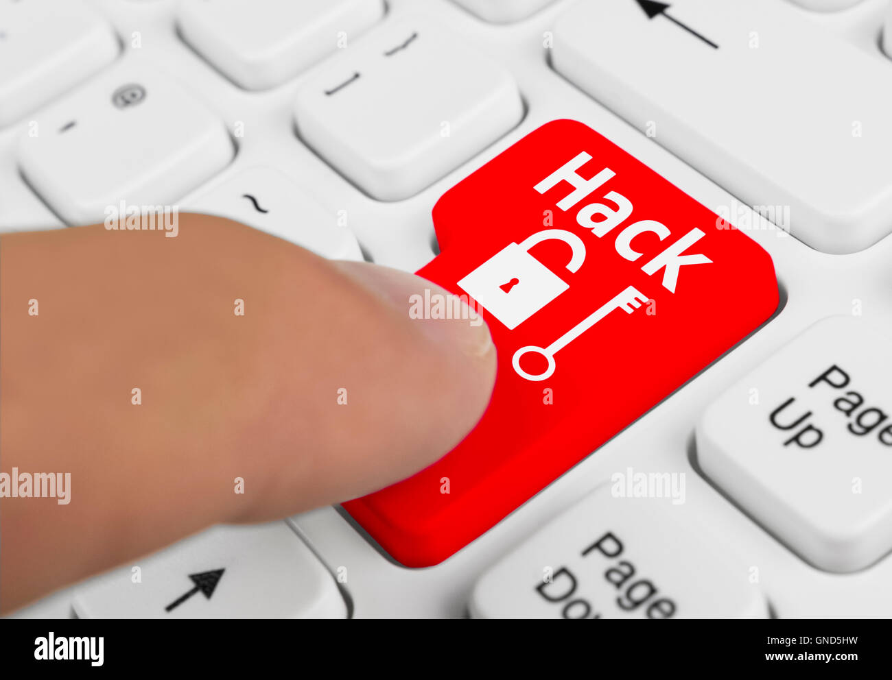 Computer hack button being pressed on a computer keyboard. Stock Photo