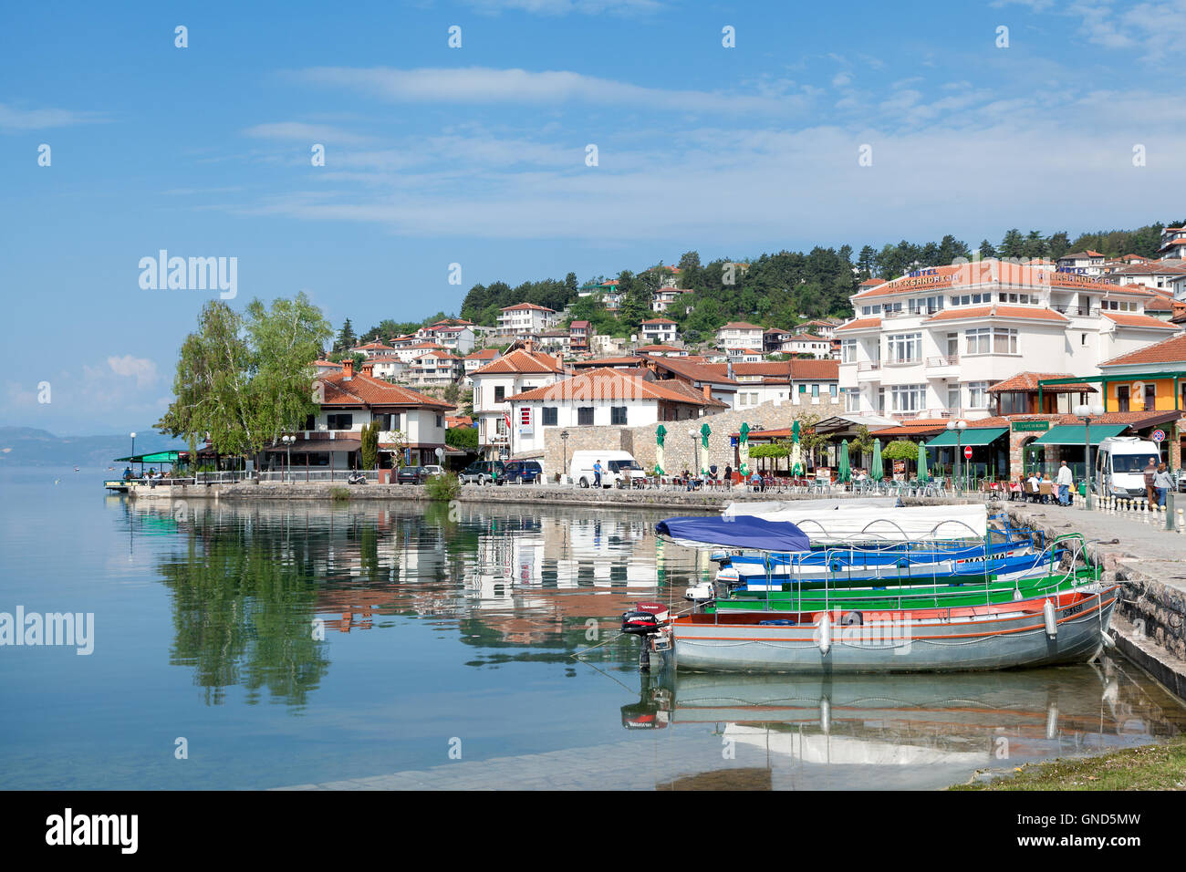 Ohrid, Macedonia - May 9, 2016 : Fishing boats on the Lake Ohrid with old town in the background. Stock Photo