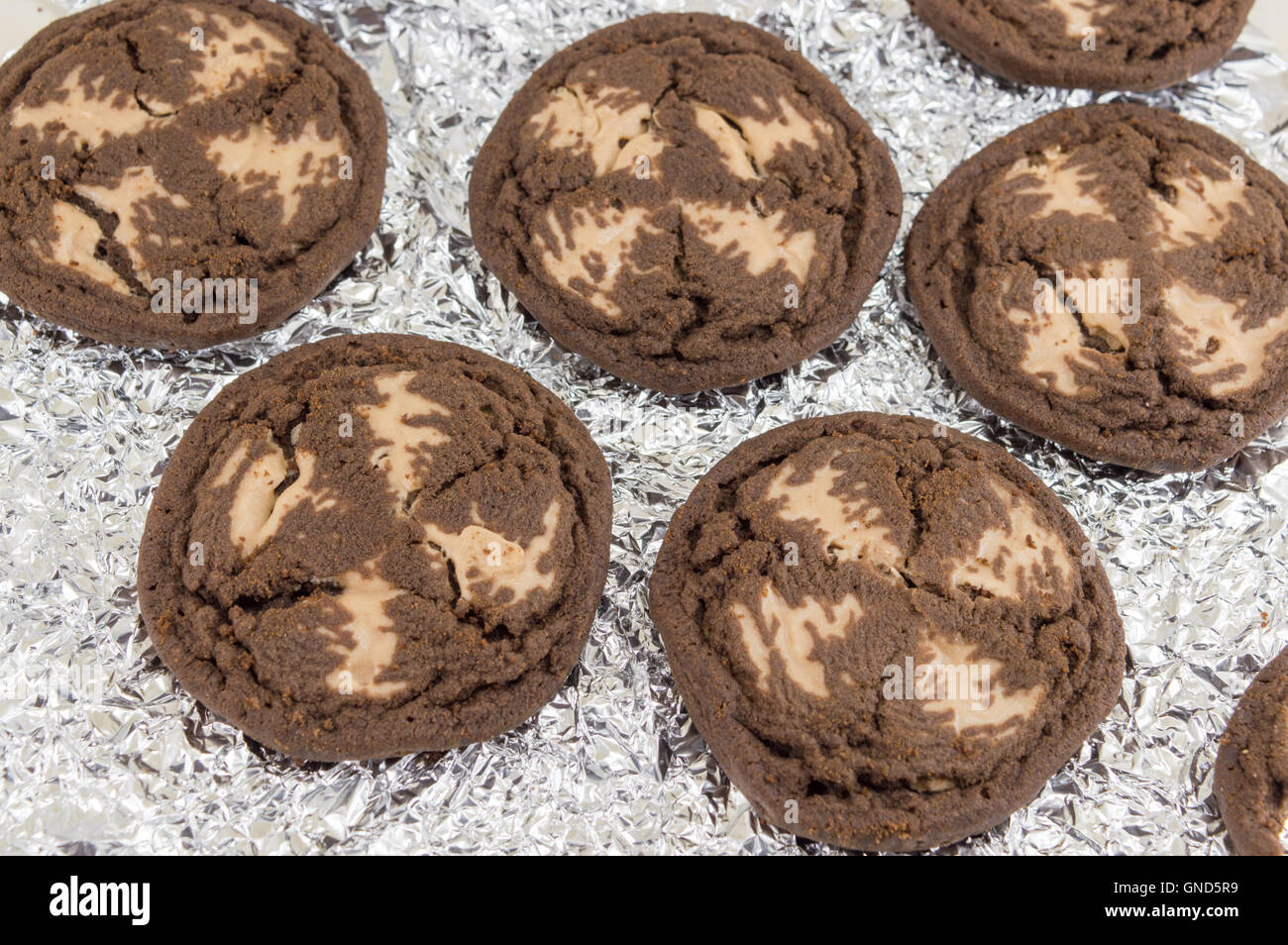 Chocolate chip brown cookies on aluminum foil Stock Photo