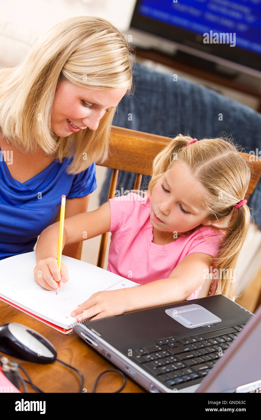 Girl and mother at home, doing school related activities flash cards