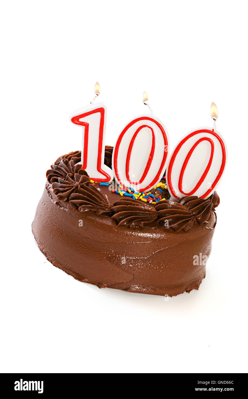 Isolaed on white chocolate frosted cake with various numbered candles on top. Stock Photo