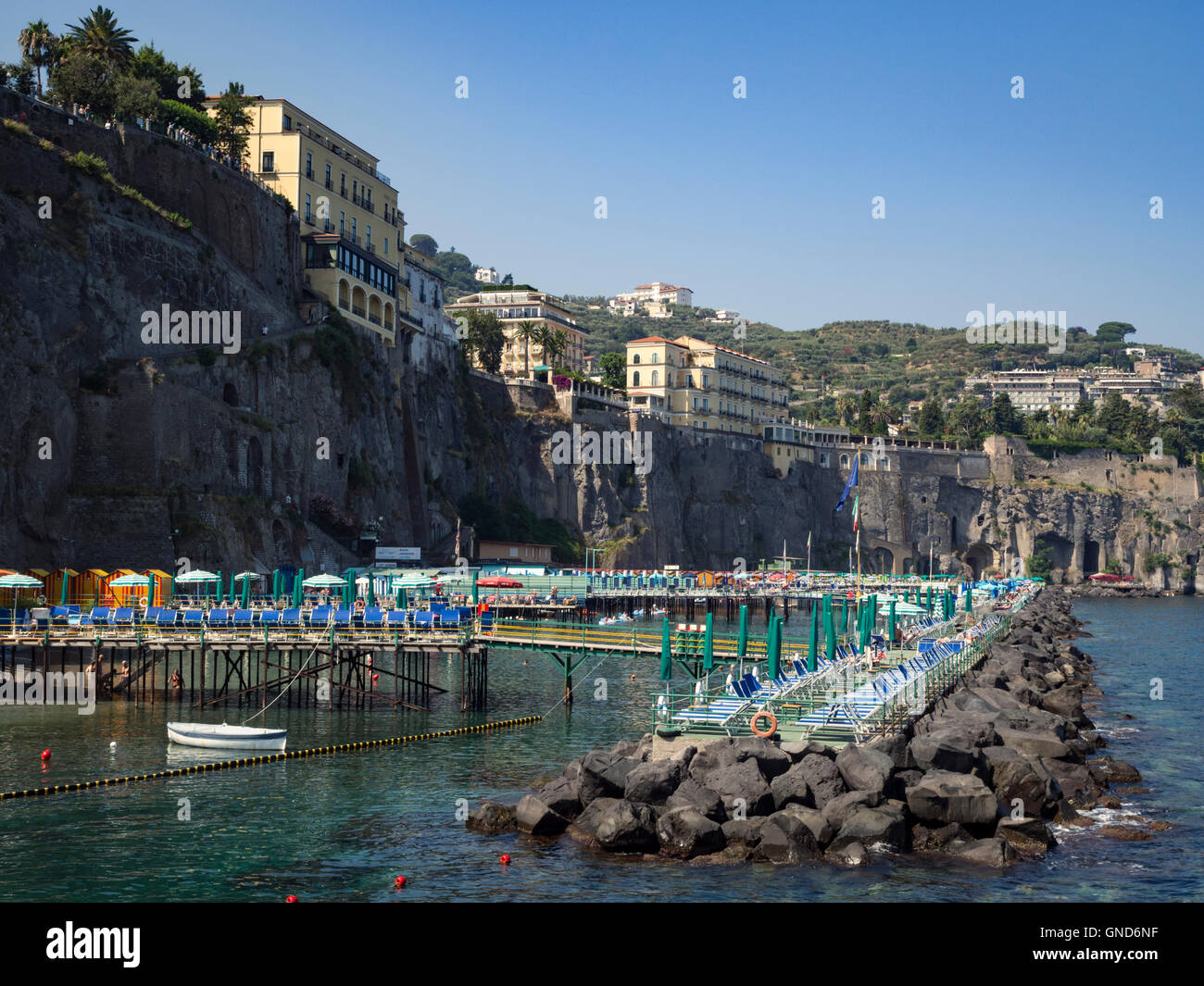 Cliff top hotels and bathing area in Sorrento Italy Stock Photo
