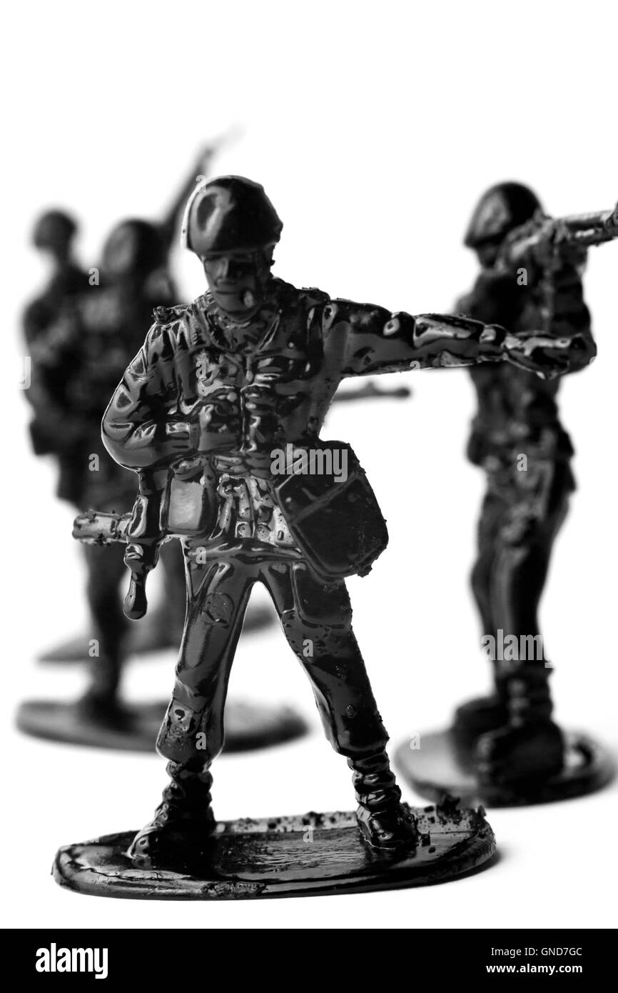 Dramatic toy army soldiers lined up for battle in black and white image Stock Photo
