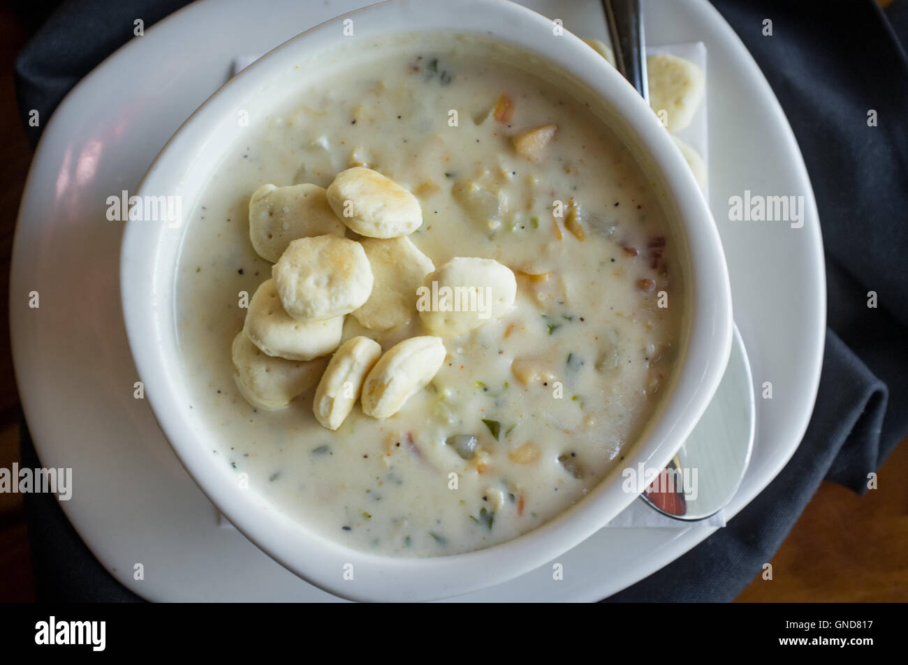 Creamy New England Clam Chowder garnished with oyster crackers 