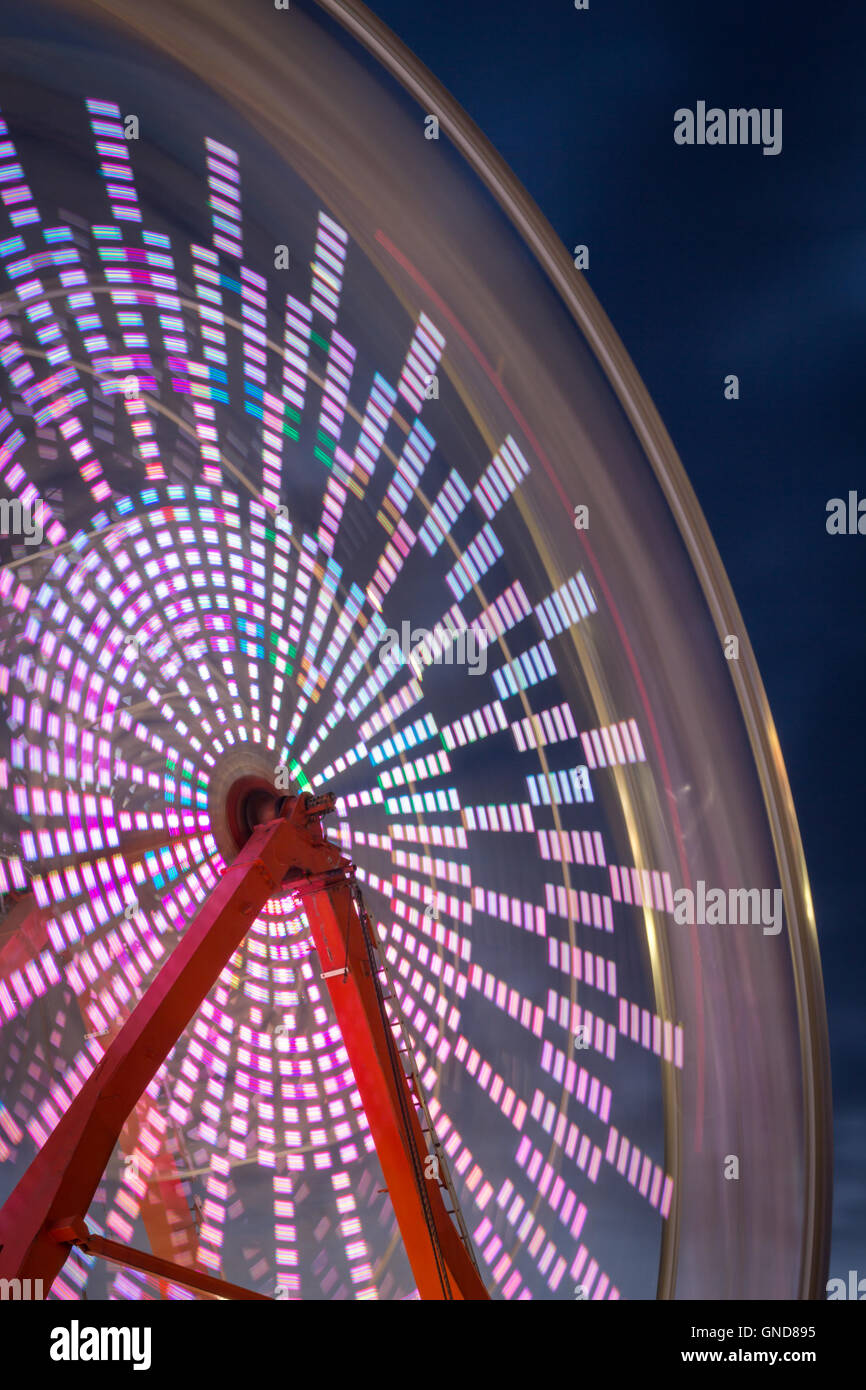 Summer carnival ferris wheel at night with light blur time lapse Stock ...