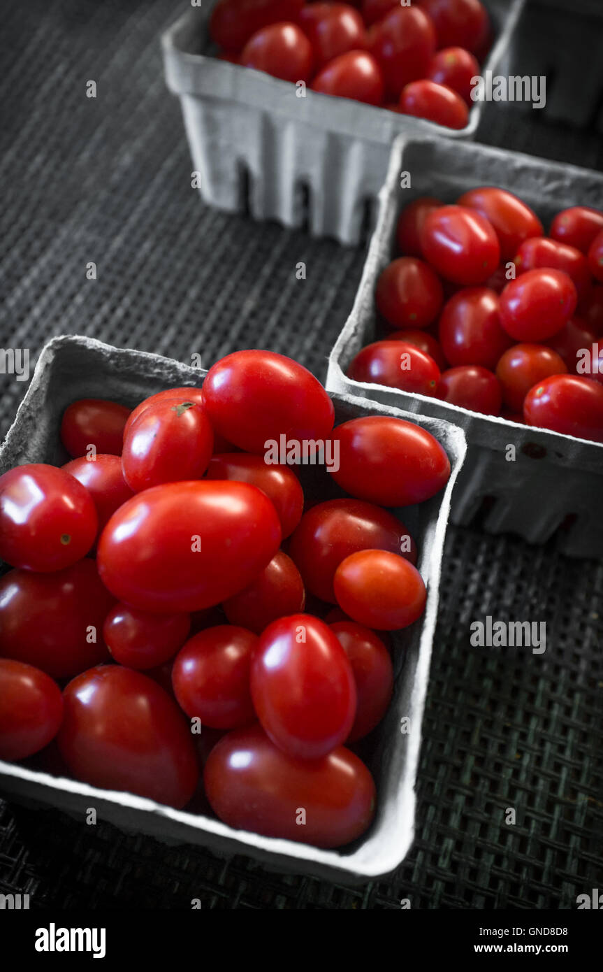 Baskets of fresh organic red grape tomatoes at local farmers market ...