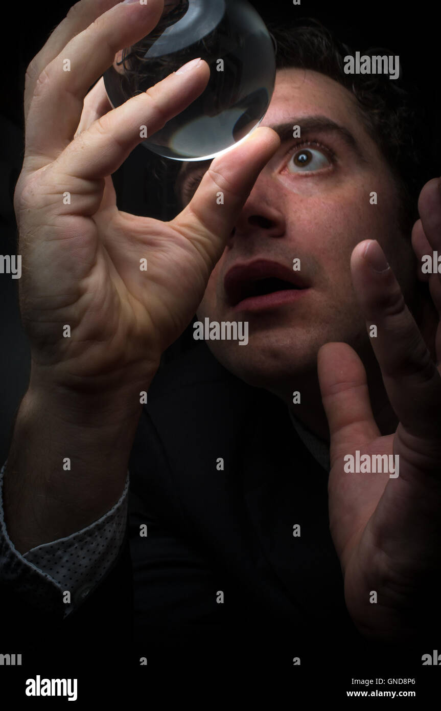 Holding magic crystal ball in fortune teller business background Stock ...