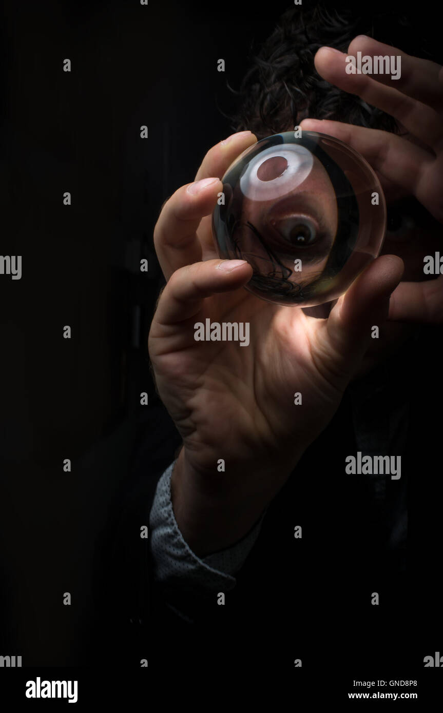 Holding magic crystal ball in fortune teller business background Stock ...