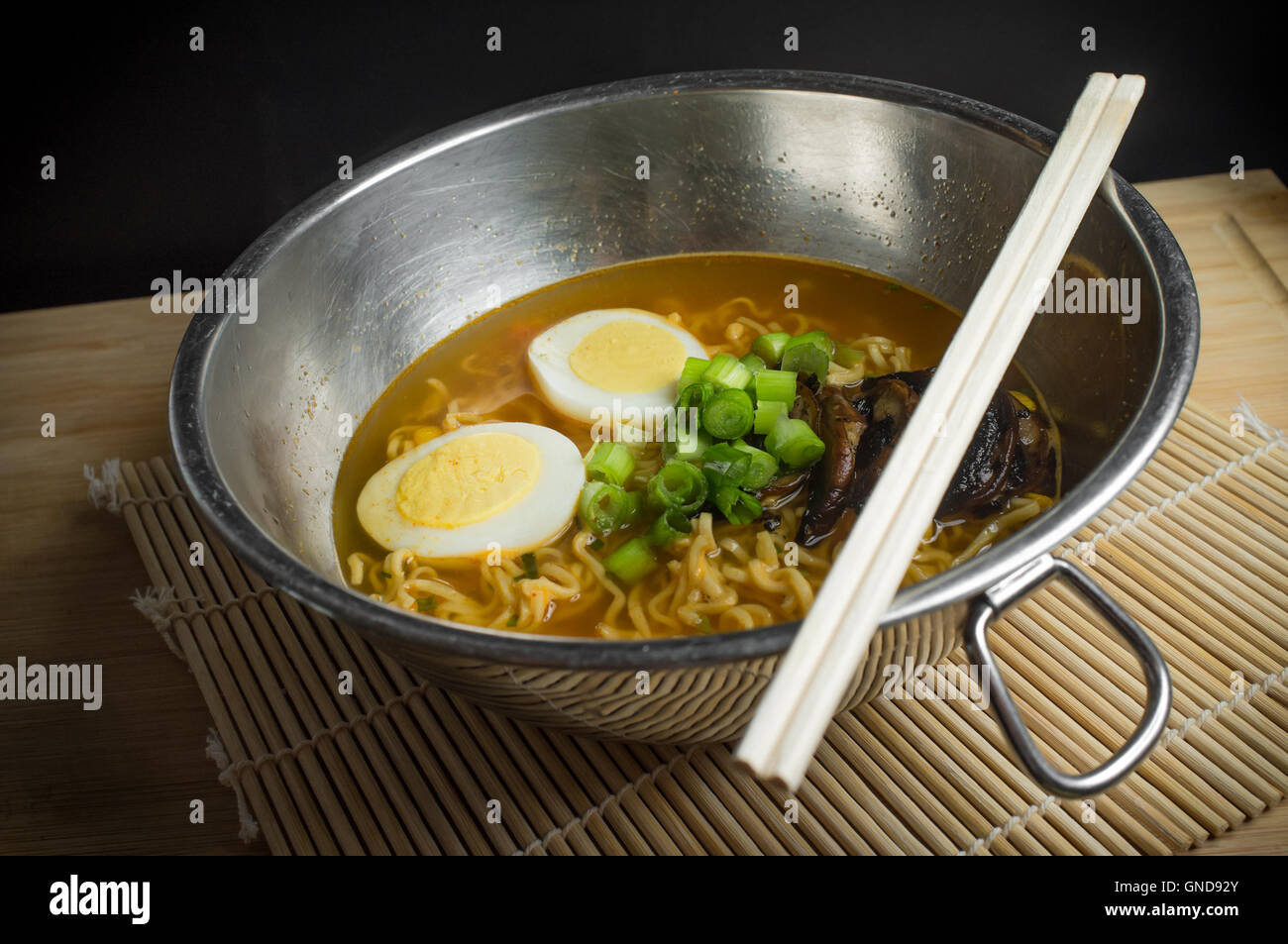 Korean cuisine ramen noodle soup with mushrooms and hard boiled eggs