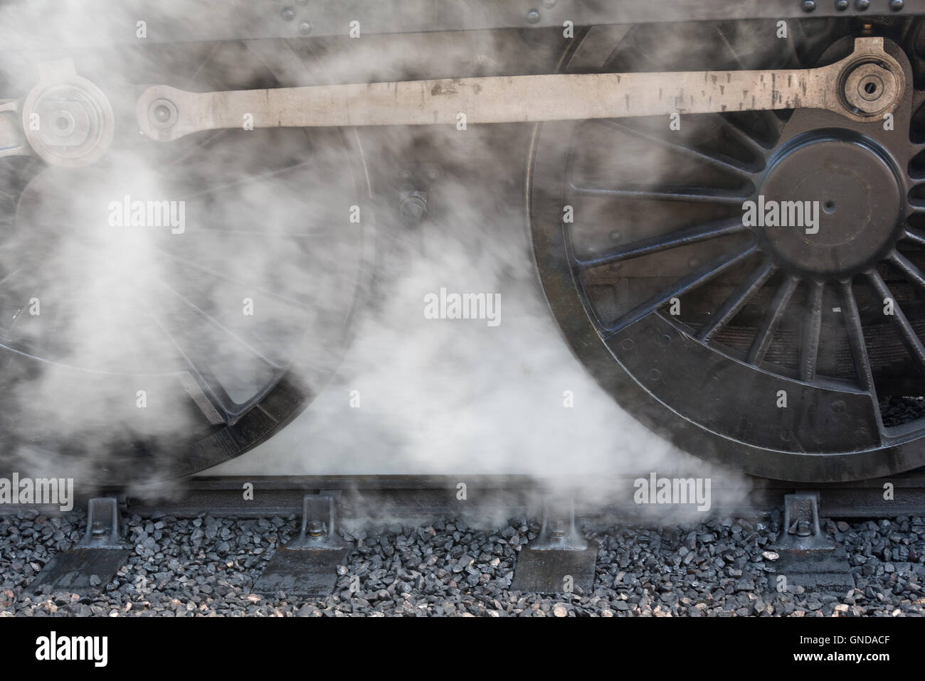 Steam around the wheels of 6960 Raveningham Hall at Bishops Lydeard station on the West Somerset Railway Stock Photo