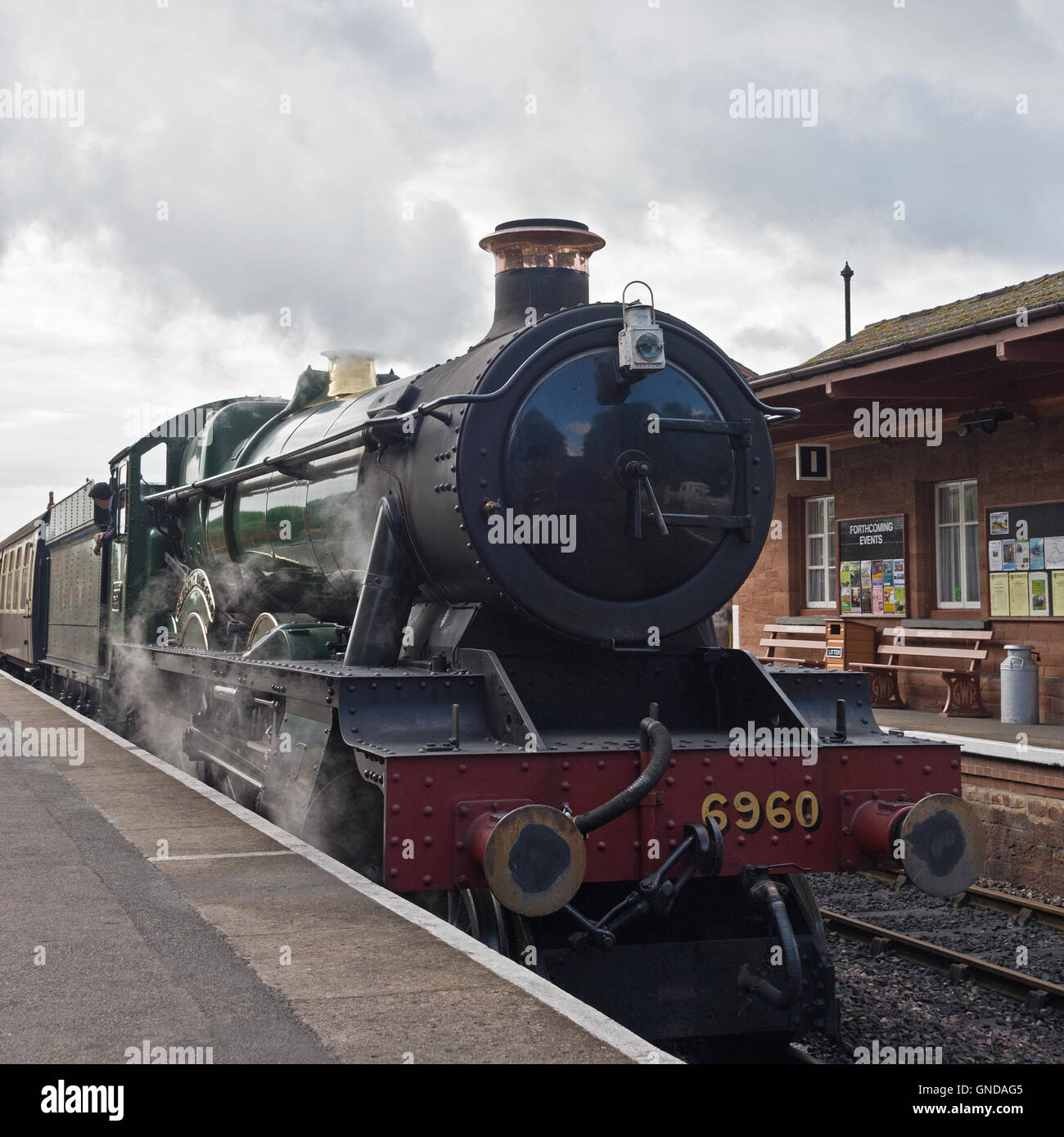 Steam engine 6960 Raveningham Hall preparing to leave Bishops Lydeard station on the West Somerset Railway Stock Photo