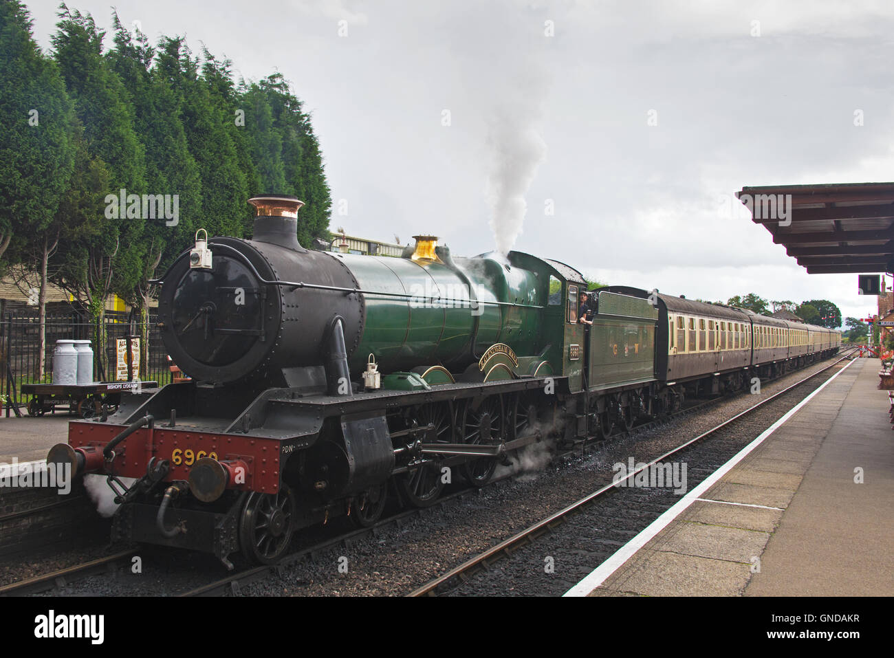 Steam engine 6960 Raveningham Hall preparing to leave Bishops Lydeard station on the West Somerset Railway Stock Photo