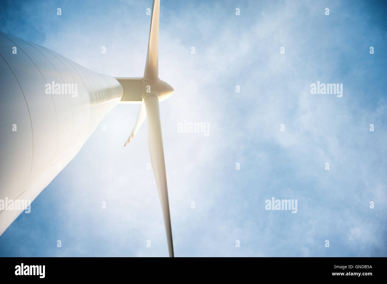 Wind turbine against deep blue sky Stock Photo - Alamy