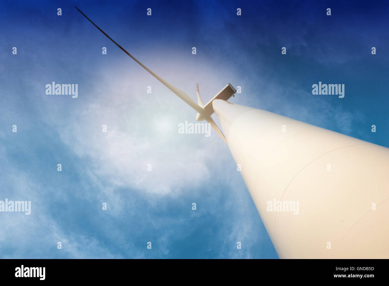 Wind turbine against deep blue sky Stock Photo - Alamy