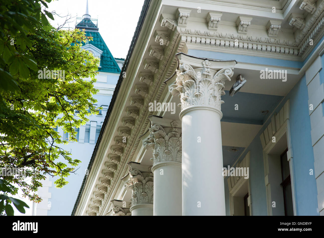 white columns on the facade of the building in classical style Stock Photo