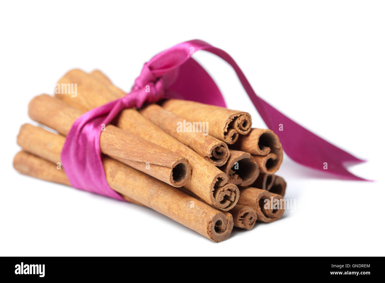 cinnamon with pink ribbon isolated Stock Photo Alamy
