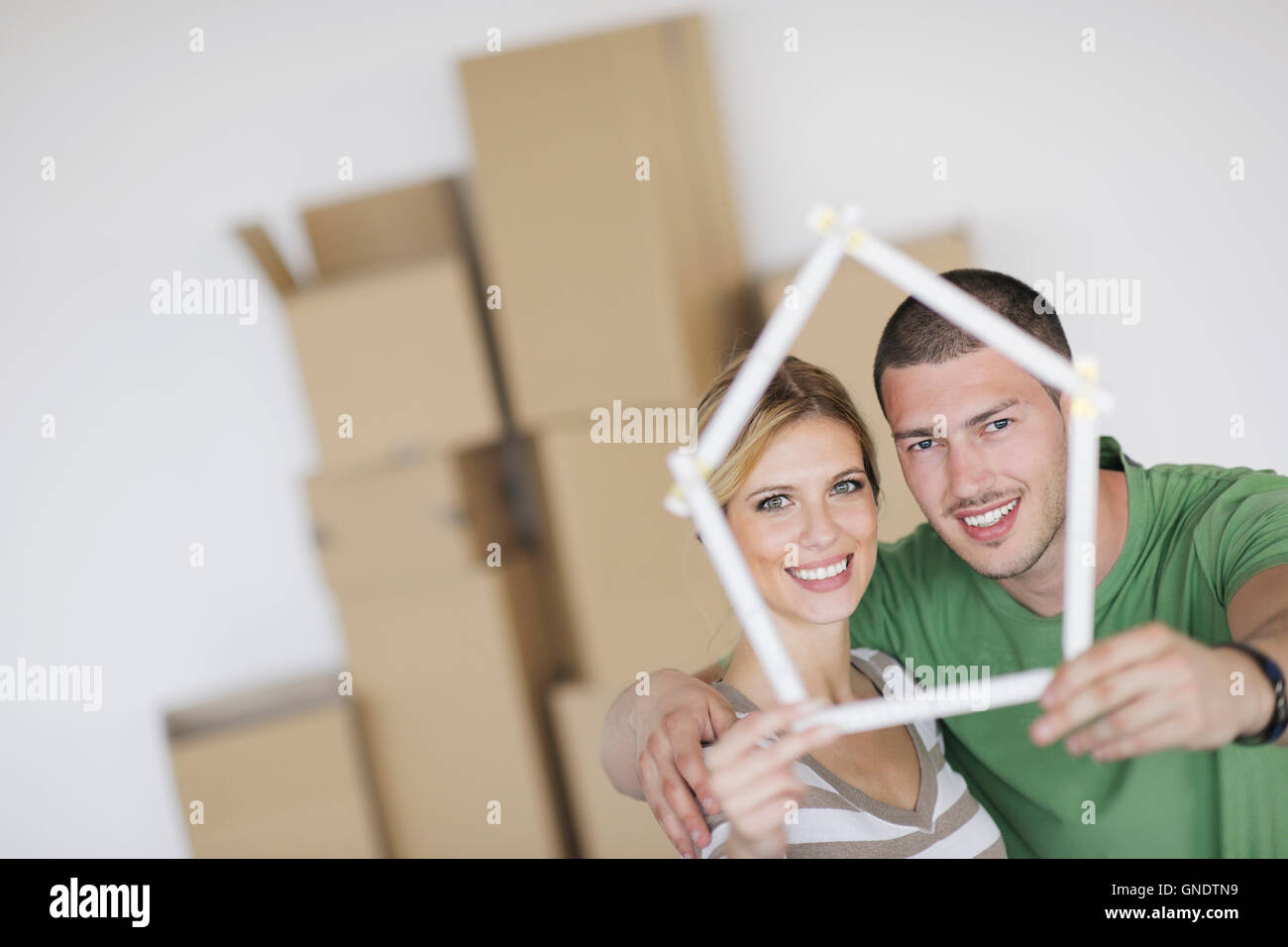Young couple moving in new home Stock Photo - Alamy