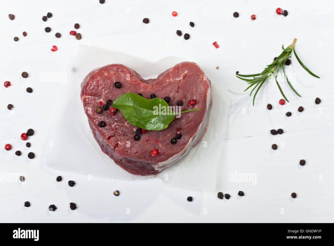 heart shaped piece of beef fillet Stock Photo Alamy