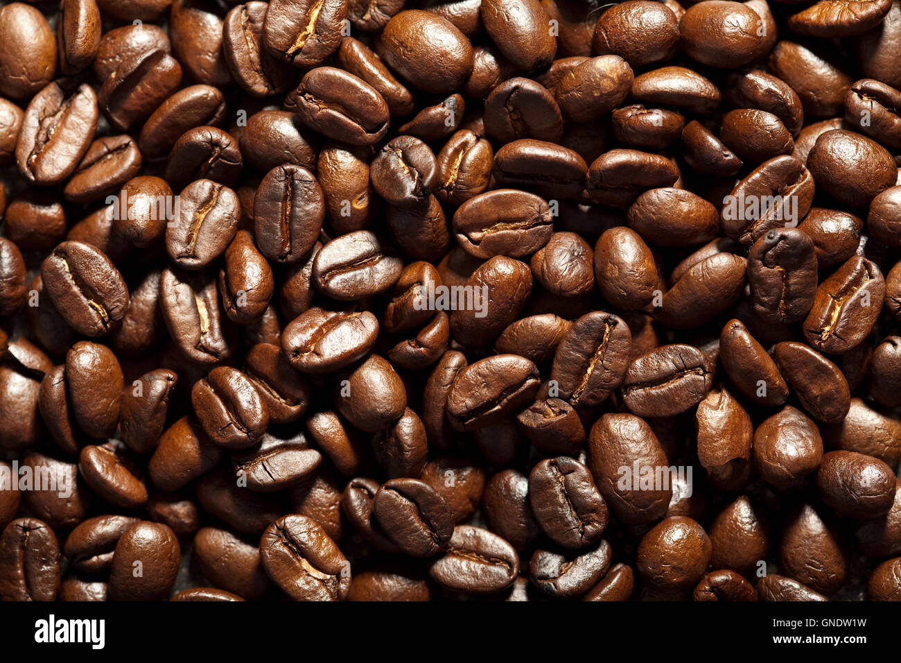 roasted coffee beans background Stock Photo - Alamy