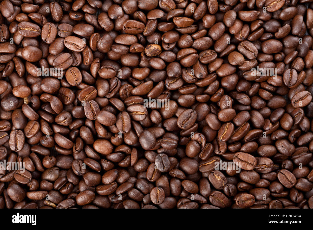 roasted coffee beans background Stock Photo - Alamy