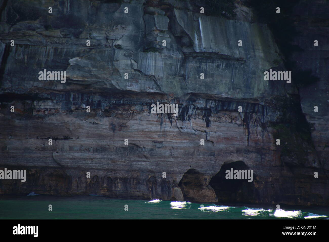 Waves lining to cliff at Pictured Rocks National Park, MI, USA Stock Photo