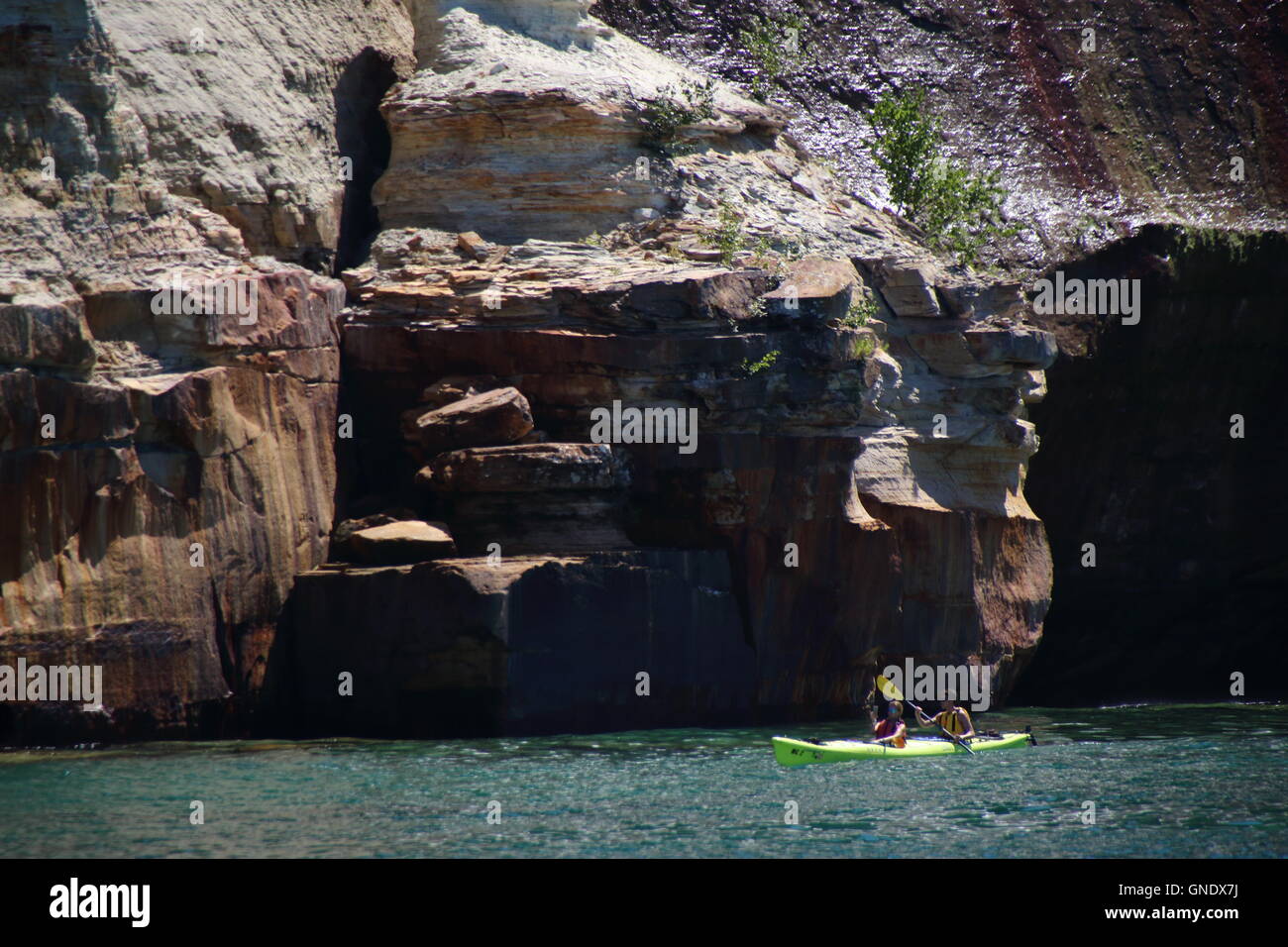 Double Kayak at Pictured Rocks National Park, MI, USA in front of colored stone formations on coast of Lake Superior. Stock Photo