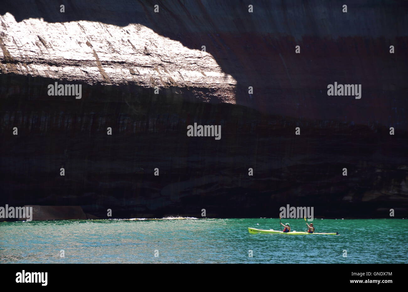 Double Kayak at Pictured Rocks National Park, MI, USA in front of cliff Stock Photo