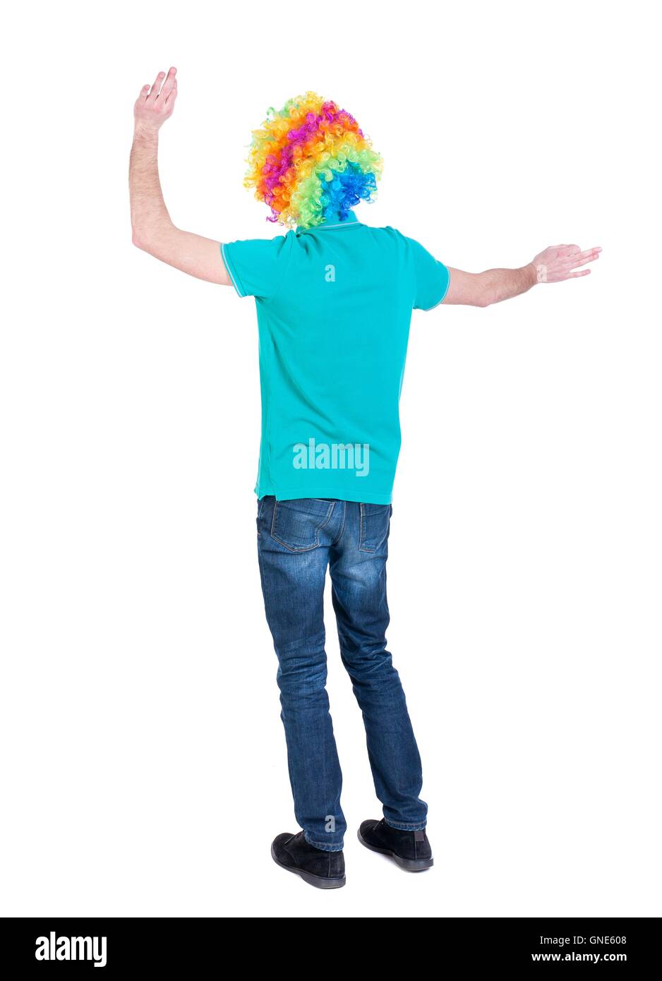 back view of dancing young beautiful man in clown wig Stock Photo Alamy