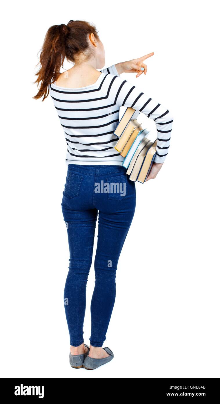 Girl with a stack of books points the finger. Stock Photo