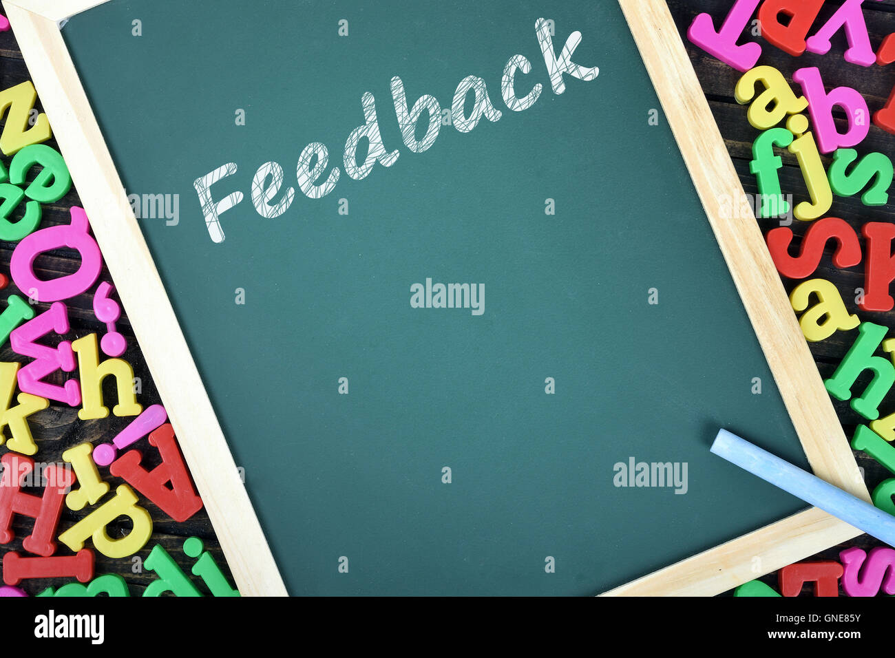 Feedback text on school board and magnetic letters Stock Photo