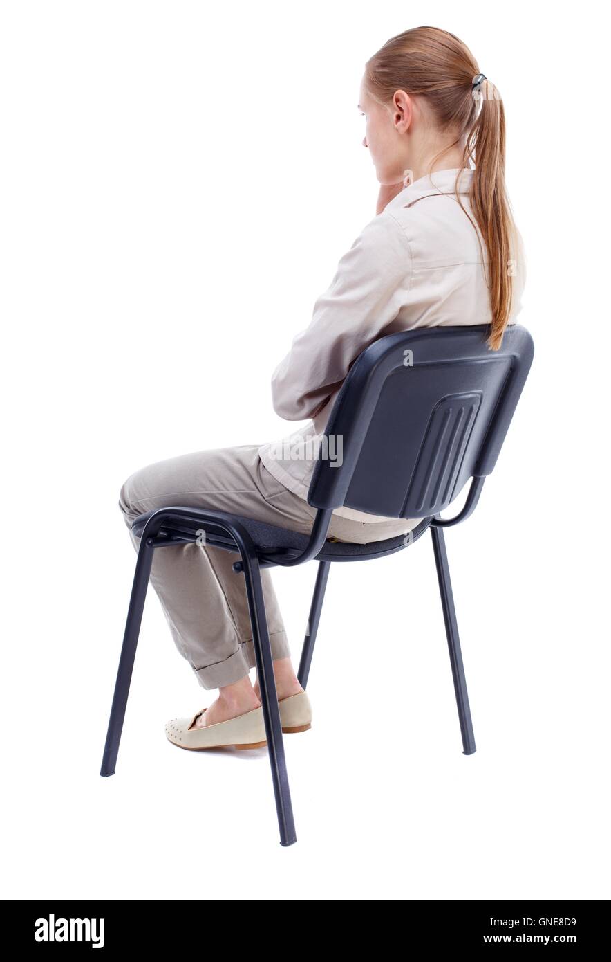 back view of young beautiful woman sitting on chair Stock Photo - Alamy