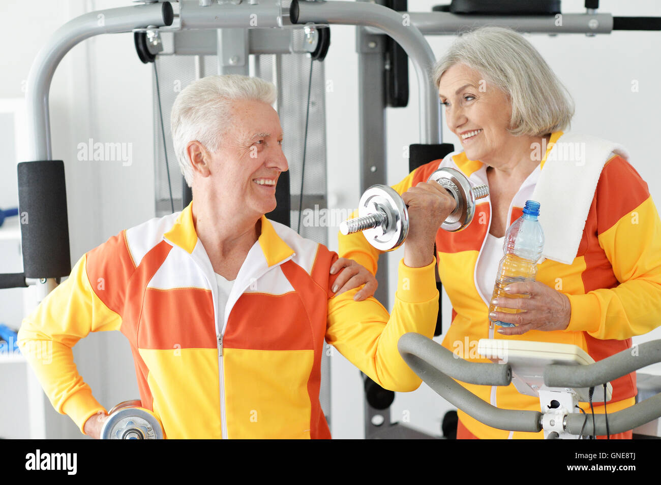 senior couple exercising in gym Stock Photo - Alamy