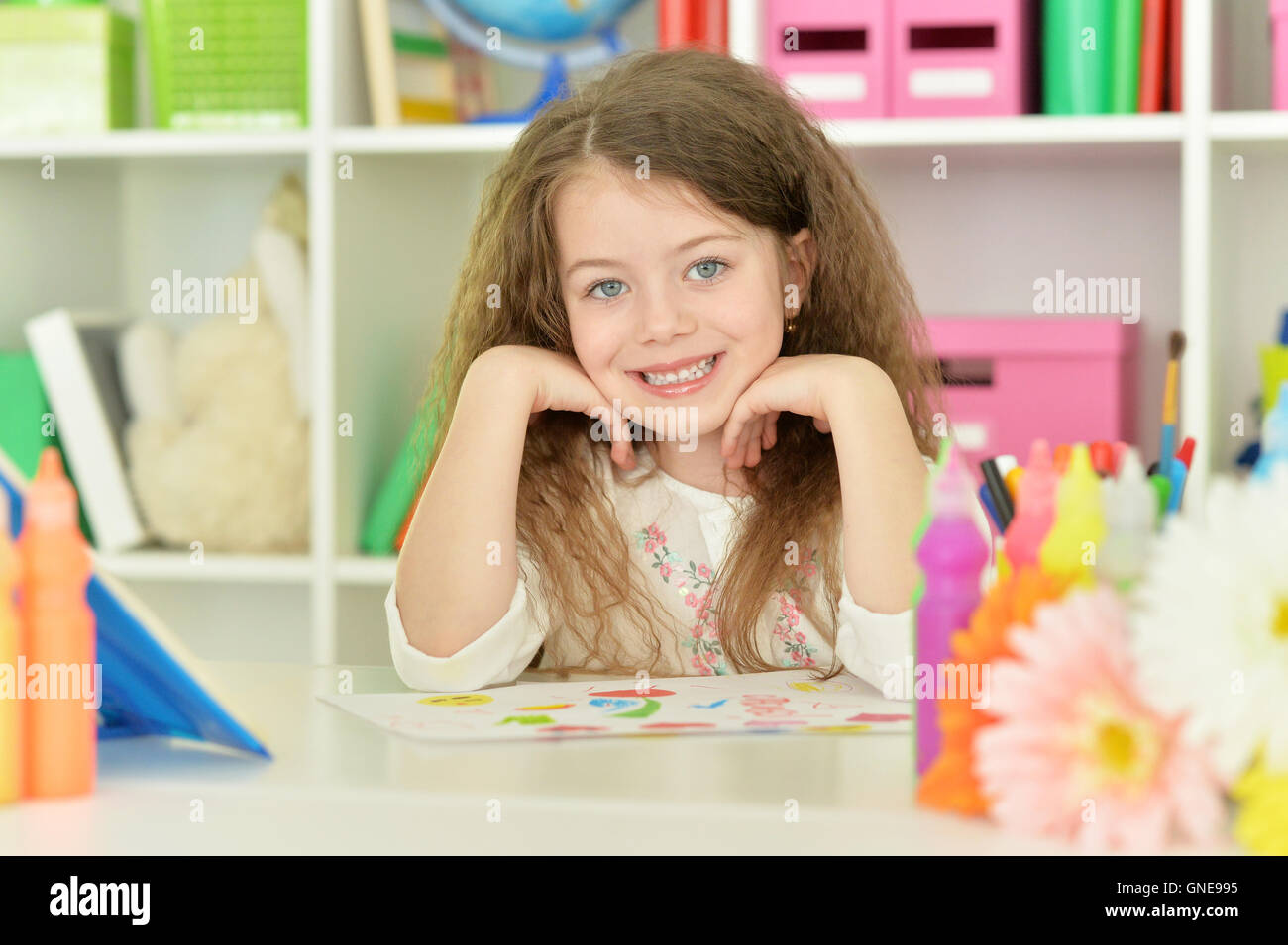 Little girl drawing at class Stock Photo - Alamy