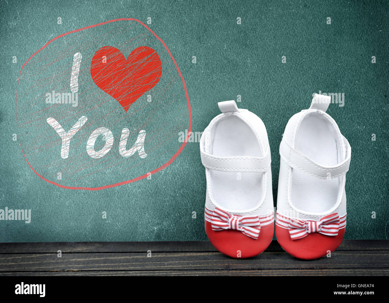 I love you text on school table and kid shoes Stock Photo
