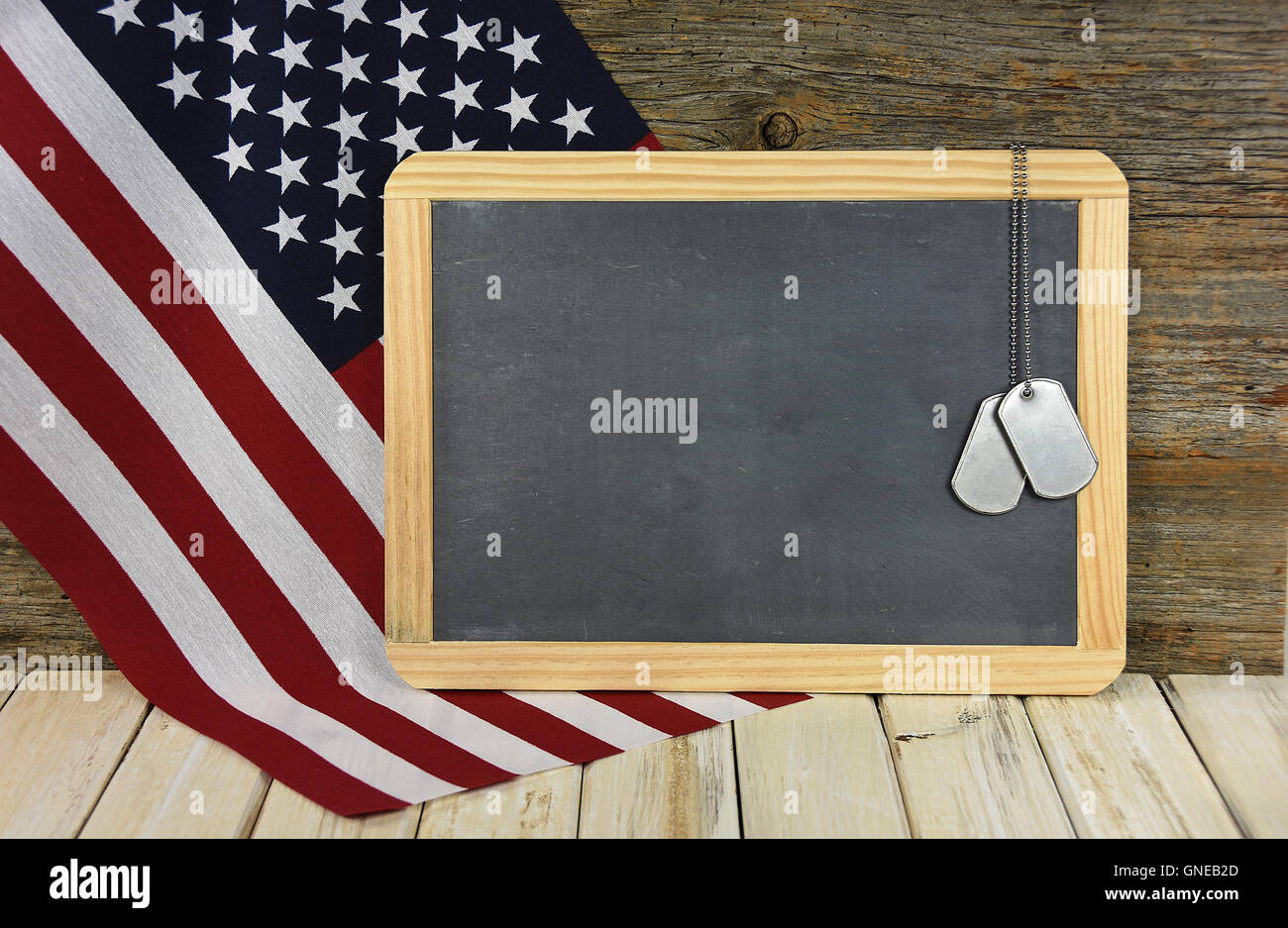 Military dog tags on black chalkboard with American flag Stock Photo ...