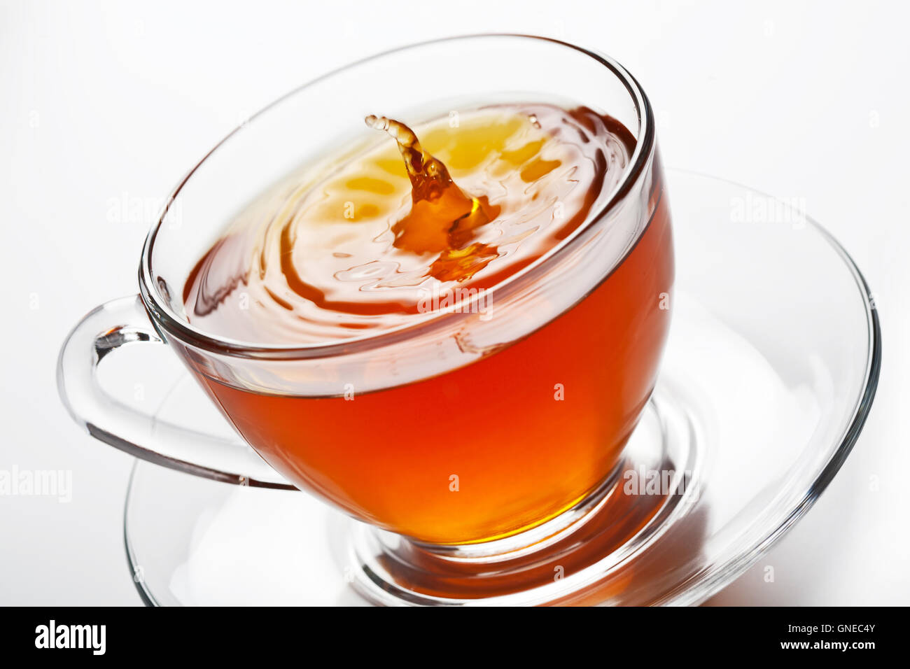 tea splash in glass cup Stock Photo - Alamy