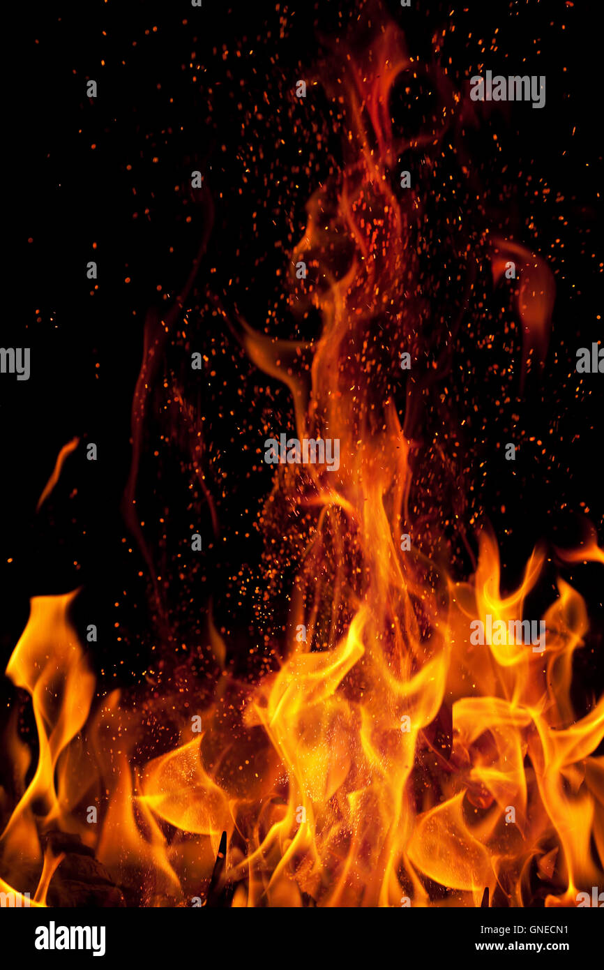 flame and sparks isolated over black background Stock Photo - Alamy