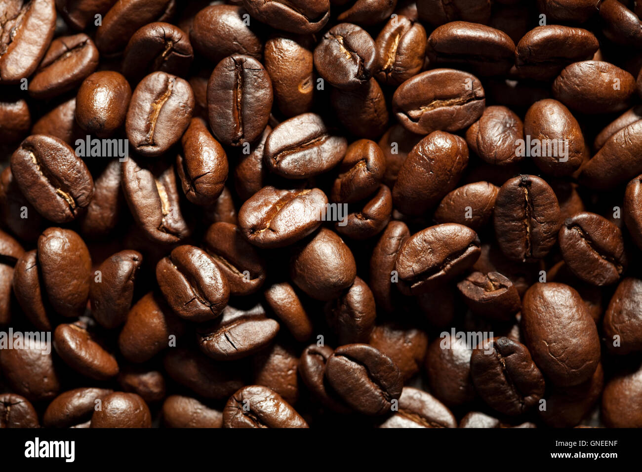 roasted coffee beans background Stock Photo - Alamy