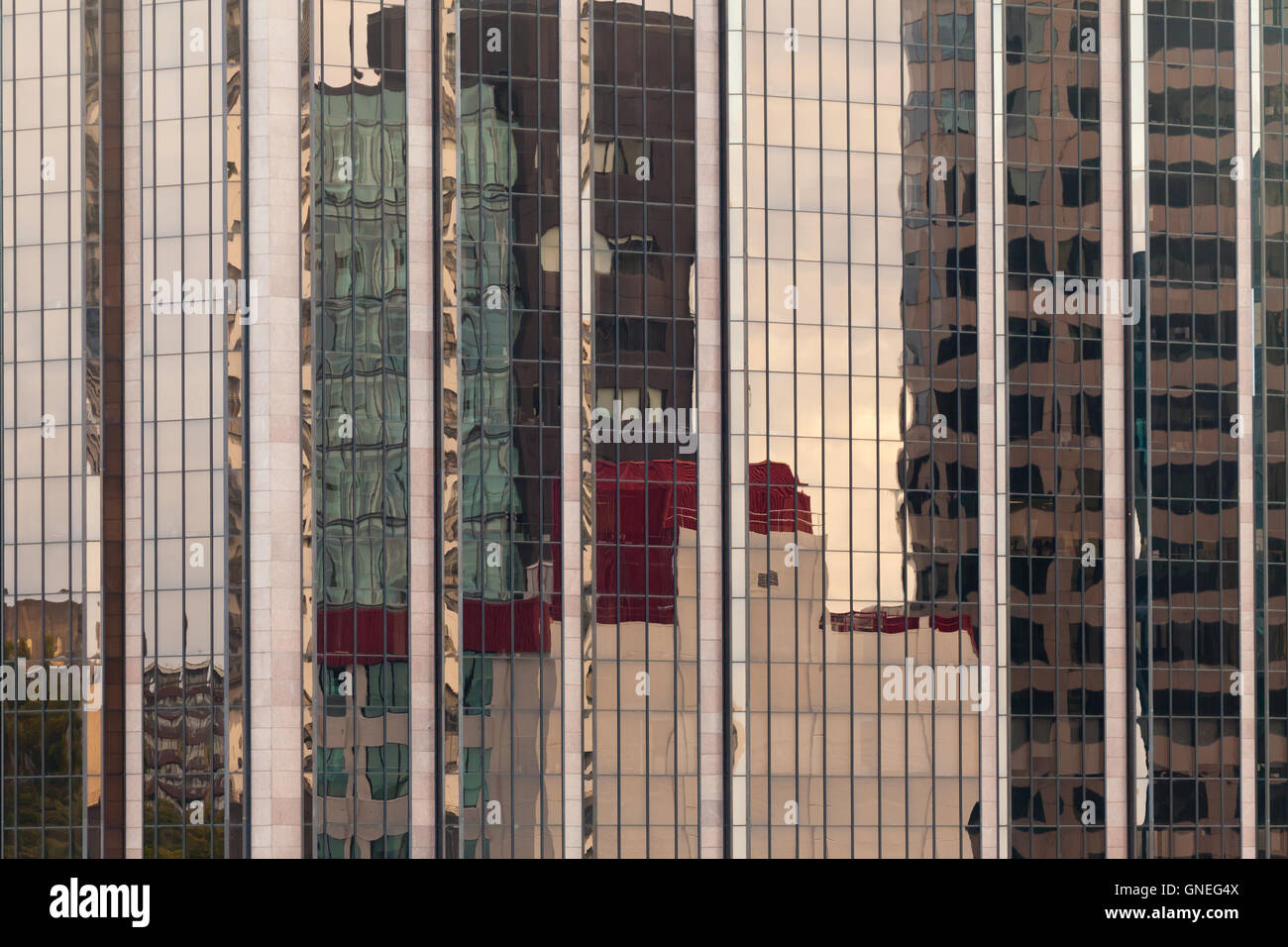 Reflections in modern glass-walled building facade Stock Photo - Alamy