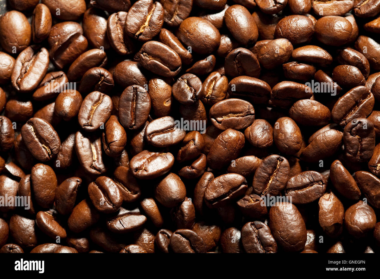 roasted coffee beans background Stock Photo - Alamy